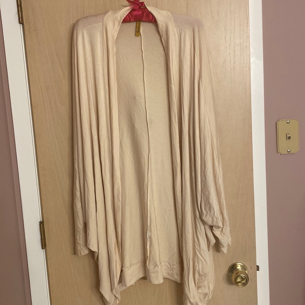 Jacket is a blend of cape and jacket with arms. Perfect condition